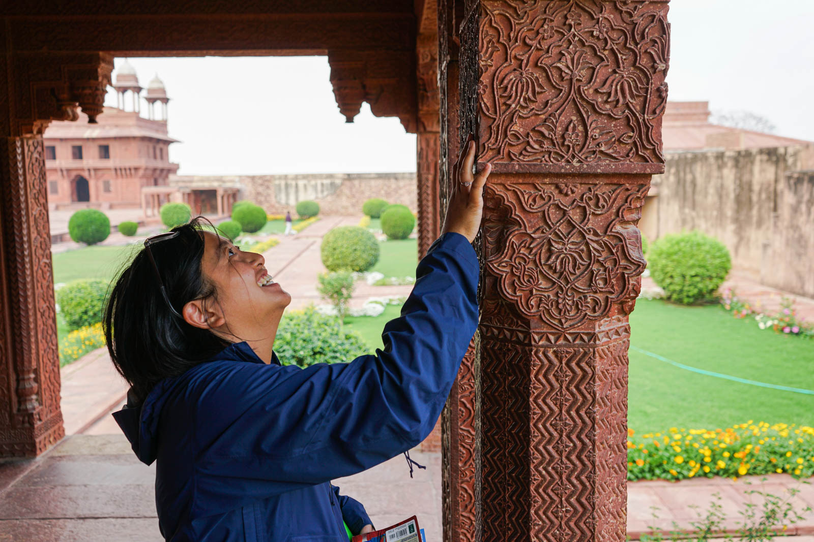 Admiring the intricate columns at Fatehpur Sikri
